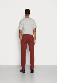Levi's® Chinos - fired brick