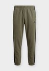 ESSENTIALS 3 STRIPES TAPERED CUFFED PANTS - Παντελόνι φόρμας - olive four/black