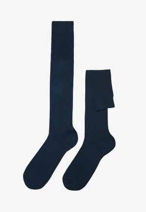 Calze di colore blu navy scuro, al ginocchio e alla caviglia, realizzate in un tessuto a maglia morbida, con una texture a coste nei polsini.