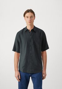 Short-sleeve, dark gray button-up shirt with a chest pocket, made of lightweight fabric, featuring a regular fit and soft texture.