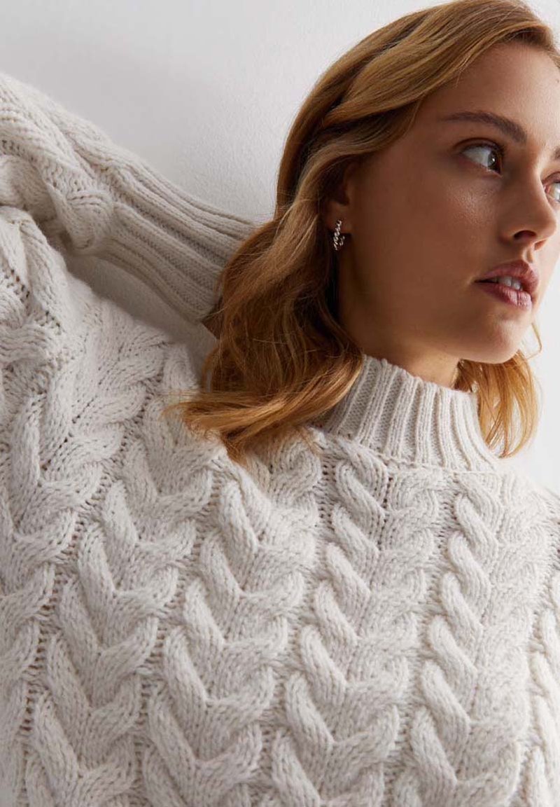 white roll neck cable knit jumper