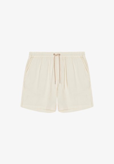 Beige casual shorts with elastic waistband, adjustable drawstring, and side pockets, designed for comfort and everyday wear.