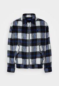 Fleece jacket in a black, white, and gray plaid pattern with blue accents. Features a front zipper and side pockets, with a collar.