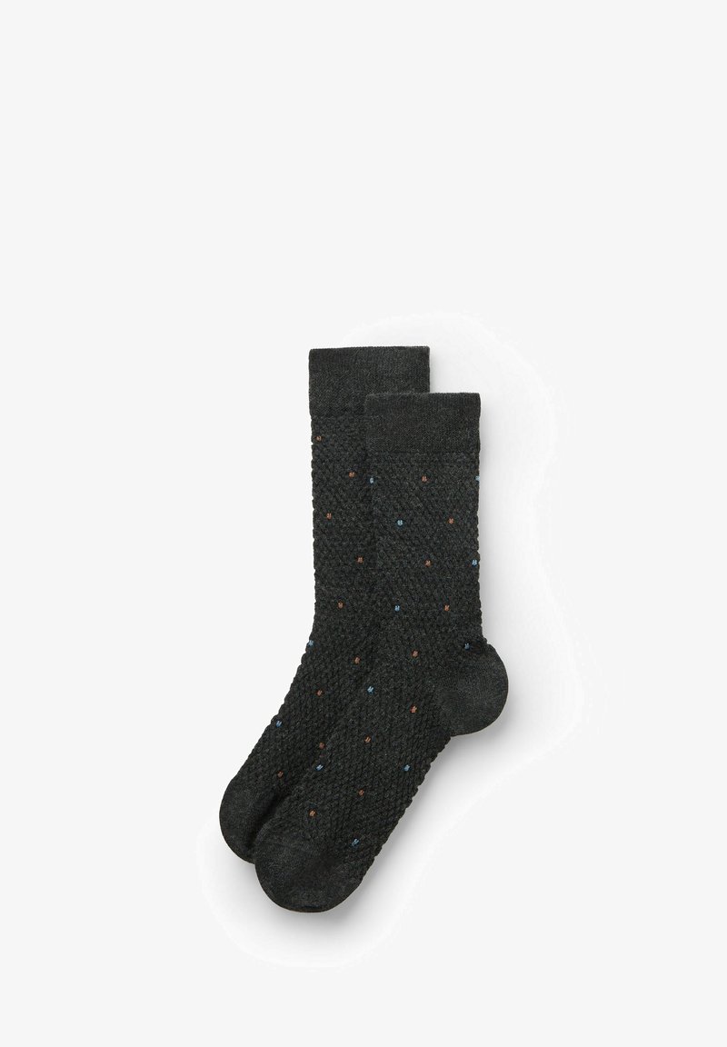 Calze grigie scure con un motivo testurizzato, arricchite da piccole macchie blu e marroni. Parte superiore a coste e forma standard delle calze.