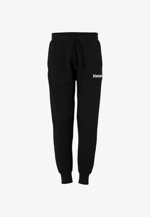Black sweatpants made of soft fabric, featuring a drawstring waist and ribbed cuffs. "Kempas" logo printed in white on the left thigh.