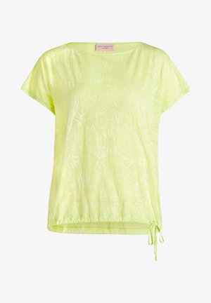 Blouse à manches courtes jaune clair avec un motif floral subtil, encolure ronde et détail de cordon ajustable à l'ourlet du côté droit.