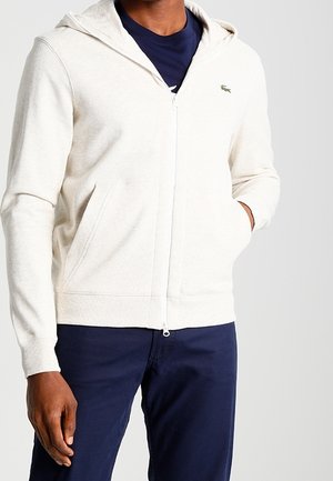 Tröja med dragkedja - beige