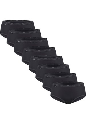 Sept culottes noires taille haute de style slip disposées en diagonale avec de petites étiquettes de marque sur la ceinture côté gauche.