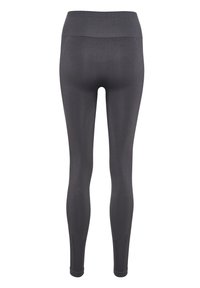 Högmidjade svarta leggings med ett mjukt, stretchigt tyg, som har en texturerad midja och bakre söm som ger flexibilitet och komfort.