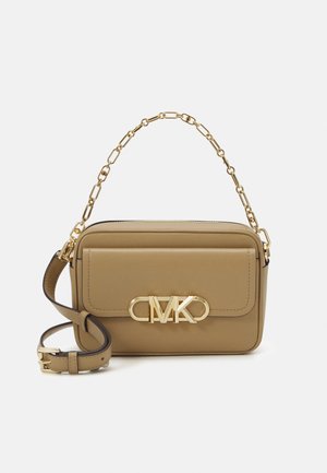 Tan leather crossbody bag with gold chain handle, adjustable strap, and gold MK logo on front pocket flap.