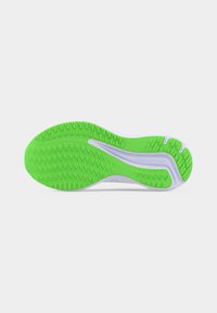 Sole of a white and green running shoe with textured grip and flex grooves on a plain light gray background.