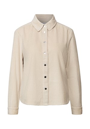 Beige corduroy overhemd met lange mouwen, een puntige kraag en zwart-witte drukknoopjes aan de voorkant.