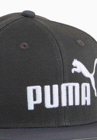 Black cap made of fabric with a flat brim, featuring white embroidered "PUMA" text and logo on the front. Textured surface, six-panel design.