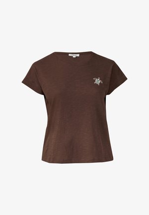 Braunes T-Shirt mit kurzen Ärmeln, das eine lockere Passform, eine weiche Textur und ein kleines Schildkrötenmotiv auf der linken Brust hat. Rundhalsausschnitt.
