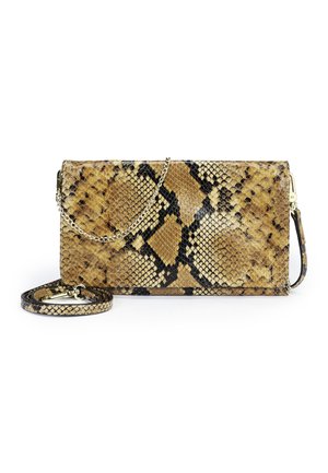 Rectangular clutch with tan and black snakeskin pattern, gold chain strap draped over, and detachable matching shoulder strap coiled beside it.
