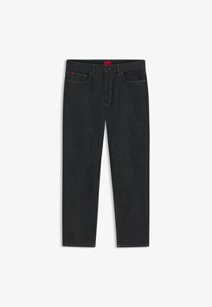 Dark wash denim jeans with a straight leg cut, featuring a red brand label at the waistband and minimal stitching detail.