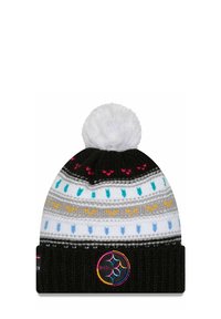 Knit beanie in black with a white pom-pom, featuring multicolored zigzag patterns and a logo patch on the cuff. Soft texture, rounded shape.
