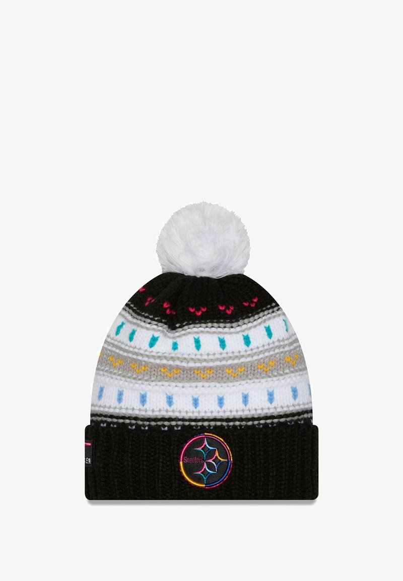 Knit beanie in black with a white pom-pom, featuring multicolored zigzag patterns and a logo patch on the cuff. Soft texture, rounded shape.