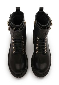 Black leather ankle boots with a smooth finish, gold hardware accents, round toe, lace-up design, and logo detail on the folded cuff.