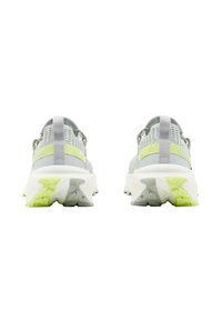 Gray athletic shoes with a textured mesh upper, a lime green rear strap, and white, rugged soles. Reflective accents near the heel.