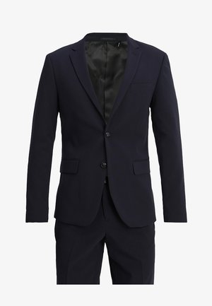 Navy blue suit jacket made of smooth fabric, featuring a notched lapel, two buttons, and two front pockets. Interior lined in black.