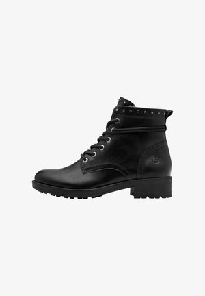 Schwarze Leder Stiefelette mit runder Zehenpartie, Schnürung vorne, Nietenakzenten am Schaftrand und einer strukturierten Gummisohle.