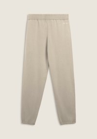 Pantaloni jogger beige chiaro realizzati in tessuto morbido, dotati di una cintura elastica e di polsini, con un piccolo logo bianco sull'anca sinistra.