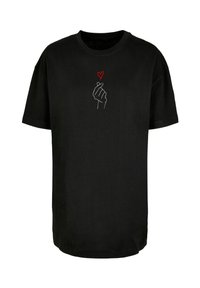 Black cotton t-shirt with short sleeves; features a white outline of a hand forming a heart gesture and a small red heart above it.