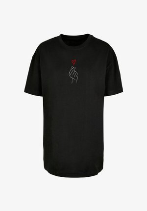 Black cotton t-shirt with short sleeves; features a white outline of a hand forming a heart gesture and a small red heart above it.