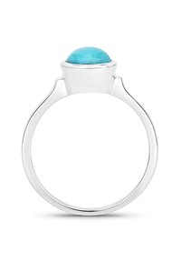 Bague en cabochon turquoise présentant une pierre turquoise lisse et arrondie, montée sur un anneau en argent poli avec un design moderne et épuré.