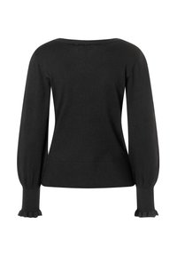 Pull en tricot noir à manches longues avec des poignets et un ourlet côtelés ajustés, présentant des détails de volants subtils aux extrémités des manches.