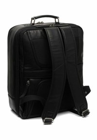 Zaino in pelle nera con spallacci imbottiti doppi, chiusure a zip, dettagli in rete e robusto manico superiore. Presenta un design elegante e funzionale.