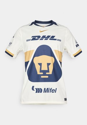 Camiseta deportiva blanca con acentos en azul marino y dorado. Presenta un gráfico de un león, el logo de "DHL" y la marca "Mifel". Diseño de manga corta y cuello redondo.
