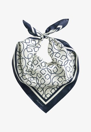 Zijden sjaal met maritiem blauw en wit geometrisch touwenpatroon, navy rand, bovenaan gestrikt in een knoop.