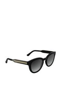 Czarne okulary przeciwsłoneczne z okrągłymi, dużymi soczewkami. Teksturowane złote akcenty na zausznikach i matowe czarne wykończenie. Gradientowe ciemne soczewki.