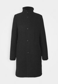 Manteau en laine noir longueur genou avec col montant et cinq boutons sur le devant, manches longues, et poches latérales dissimulées.