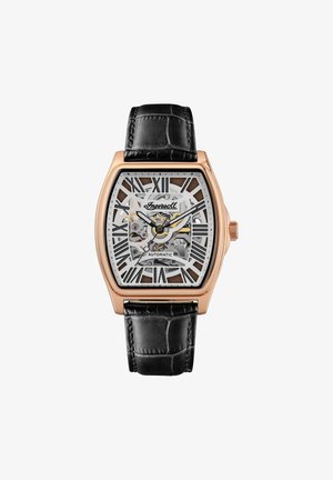 Square watch with rose gold-tone case. Transparent dial displays automatic movement. Black crocodile leather strap, large silver Roman numerals.