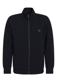 Giacca a zip blu navy con colletto alto, realizzata in tessuto testurizzato. Presenta polsini e orlo a costine, oltre a un piccolo logo sul lato sinistro del petto.
