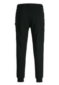 Zwarte katoenen joggers met een elastische tailleband, taps toelopende pijpen en ribbed cuffs. Soepele textuur, geen zichtbare patronen of accenten.