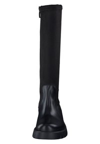 Botas negras hasta la rodilla con una puntera de cuero suave y un upper de tela blanda, con una pestaña en la parte trasera para facilitar su uso.