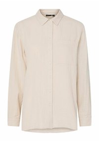 Camicia lungo maniche beige realizzata in tessuto morbido e testurizzato. Presenta una chiusura frontale con bottoni, colletto e una singola tasca sul petto.