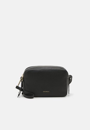 Black leather crossbody bag with a pebbled texture, rectangular shape, gold zipper, and a detachable strap; features branding on the front.