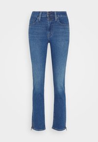 Jeans de mezclilla azul con un corte slim, acabado desgastado, dobladillos con cremallera, cierre de botón y bolsillos frontales. Ideales para un uso casual.