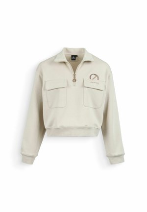 Felpa corta beige con zip frontale, due tasche con pattina e un logo rotondo con testo sul petto a sinistra.