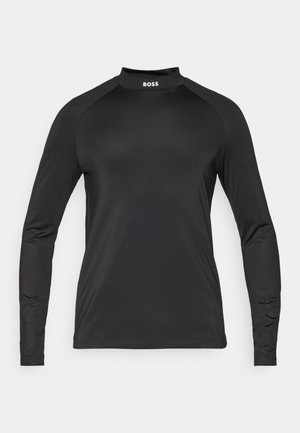 Must värviline spordisärk, millel on kõrge kaelus, sile tekstuur ja raglanvarrukad. Kaeluses on logo.