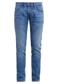 Raka blå denimjeans med en blekt finish, fem fickor och knäppning fram. Har kontrasterande sömmar och en midjehight som är medelhög.
