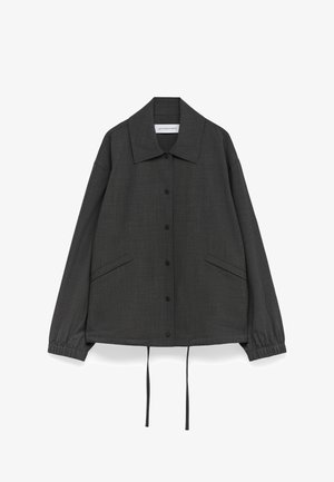 Gray button-up jacket made from textured fabric, featuring a large collar, two front pockets, and adjustable drawstring at the waist.