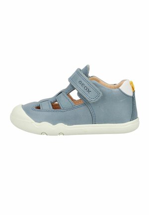 Blue children's closed-toe sandal with adjustable velcro strap and white sole, featuring "GEOX" branding on the strap.