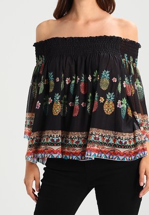 Musta olkapäät paljastava paita, jossa on smokkaukset kaula-aukossa ja värikkäitä ananas- ja kukkakuvioita. Laajenevat hihat ja kuvioitu helmareunus.