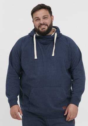 Navy blue hooded sweatshirt with beige drawstrings, front pocket, ribbed cuffs, and a small leather logo patch at the hem.